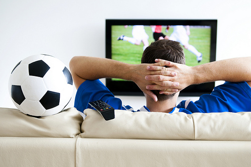 Soccer fan watching tv